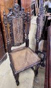 A set of four late 19th century Flemish style carved oak dining chairs with caned seats