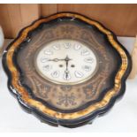 A late 19th century oval French marquetry wall clock with enamel Roman numerals, 62cm high