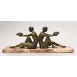 A pair of French Art Deco gilt metal and marble figural bookends, 20cm long
