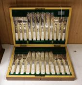A cased set of twelve mother-of-pearl handled fish knives and forks