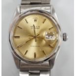 A gentleman's 1970's stainless steel Rolex Oysterdate precision wrist watch, with yellow dial, on