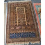 A Caucasian beige ground rug with central field of stylised motifs, 204 x 130cm