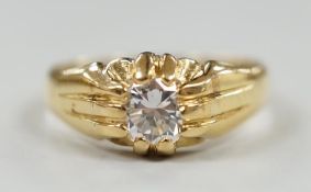 An 18ct and claw set solitaire diamond ring, size W/X, gross weight 7.3 grams.