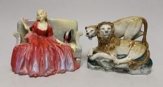 A Royal Doulton figure 'Sweet and Twenty' HN1298 and a continental porcelain lion and lioness group,