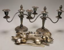 A pair of plated dwarf candelabra and a quantity of assorted plated flatware