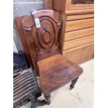 A Victorian oak hall chair