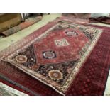 A Heriz red ground carpet, 268 x 168cm