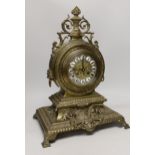 A late 19th century French Louis XIV revival brass drum shape clock, 46cm tall