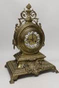 A late 19th century French Louis XIV revival brass drum shape clock, 46cm tall