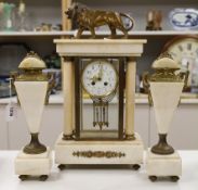 An early 20th century French four glass portico clock garniture with mercury pendulum, 50cm