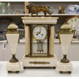 An early 20th century French four glass portico clock garniture with mercury pendulum, 50cm