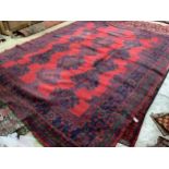 A Turkish red ground carpet, 350 x 278cm