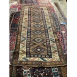 An antique Kurdistan rug, 261 x 119cm