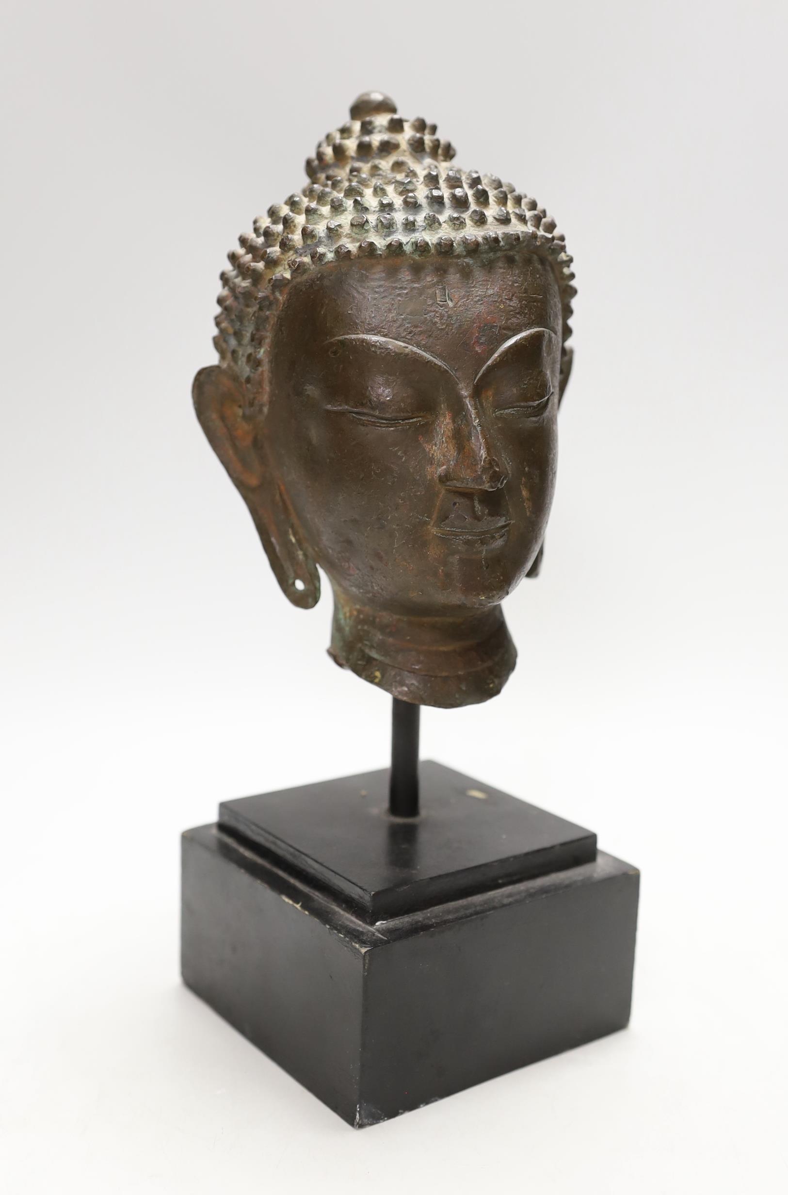 A Thai bronze Buddha head, cast bronze on stand, 17th/28th century century, vendor states belonged