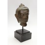 A Thai bronze Buddha head, cast bronze on stand, 17th/28th century century, vendor states belonged