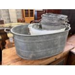 A Victorian galvanised metal wash tub, a white painted pail tub and four assorted buckets, largest