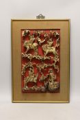 A Chinese framed gilded and lacquered wood panel, 35cm high, 22cm wide