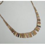 A modern three colour 9ct gold fringe necklace, 40cm, 6.7 grams.
