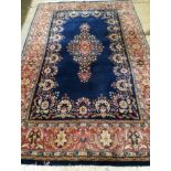 An Indian blue ground carpet, 260 x 167cm