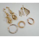 A modern pair of 9ct gold scrolling drop earrings, 47mm, three odd 9ct gold earrings and three 9ct