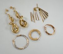 A modern pair of 9ct gold scrolling drop earrings, 47mm, three odd 9ct gold earrings and three 9ct