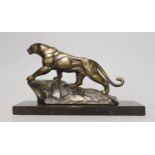 A French Art Deco spelter model of a panther, on marble base, 28cm long