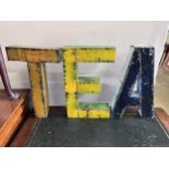 Three painted iron letters spelling TEA, height 50cm