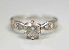 A modern 18ct gold and single stone diamond ring, with diamond set shoulders, size J, gross weight