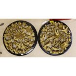 A pair of Chinese carved and gilded wood ‘birds and flowers’ roundels, 33.5cm