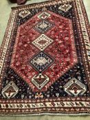 And Iranian Gashshghai super red ground carpet, 291 x 208cm