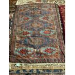 A Soumak blue ground rug, 181 x 125cm