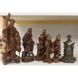 A group of five Chinese carved hardwood figures and another