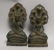 Two Cambodian bronze figures of Buddha, tallest 27cm high