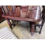 A Victorian style mahogany extending dining table, extends to 235cm, width 124cm, together with a