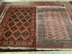 A Caucasian brick red ground rug, 196 x 120cm and a cotton pile Bokhara rug, 193 x 128cm