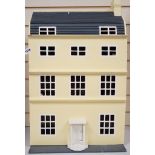 A doll's house based on a Georgian Bath townhouse, with contents, 43cm wide, 71cm high