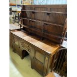 A Victorian aesthetic movement mahogany sideboard, with Latin motto to the frieze, width 168cm,