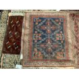 A Caucasian blue ground rug, 118 x 100cm and a Turkestan Bukhara, camel trapping, 83 x 34cm