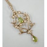 An Edwardian 9ct, peridot and seed pearl set drop pendant brooch, 57mm, on a later 375 rope twist