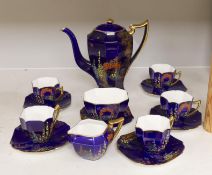 A 1930’s Shelley floral and gilt part coffee set (one cup missing), coffee pot 19cm high