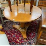 A Biedermeier style circular breakfast table, diameter 91cm, height 75cm, and a pair of elbow