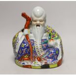 A Chinese enamelled porcelain seated figure of Shou Lao, Republic Period, 25cm tall