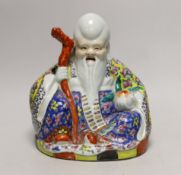 A Chinese enamelled porcelain seated figure of Shou Lao, Republic Period, 25cm tall