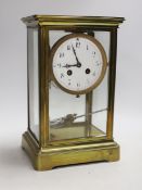 An early 20th century brass four-glass clock with mercury pendulum, 28cm high