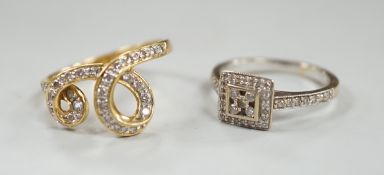 A modern 18ct gold and diamond chip set double scroll ring, size M and a modern 18ct white gold