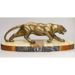 A French Art Deco model of a tiger, on marble base, 56cm long