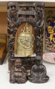 A Chinese hardwood framed bell and a similar figure of Budai, and a bronze figure of Buddha (3)