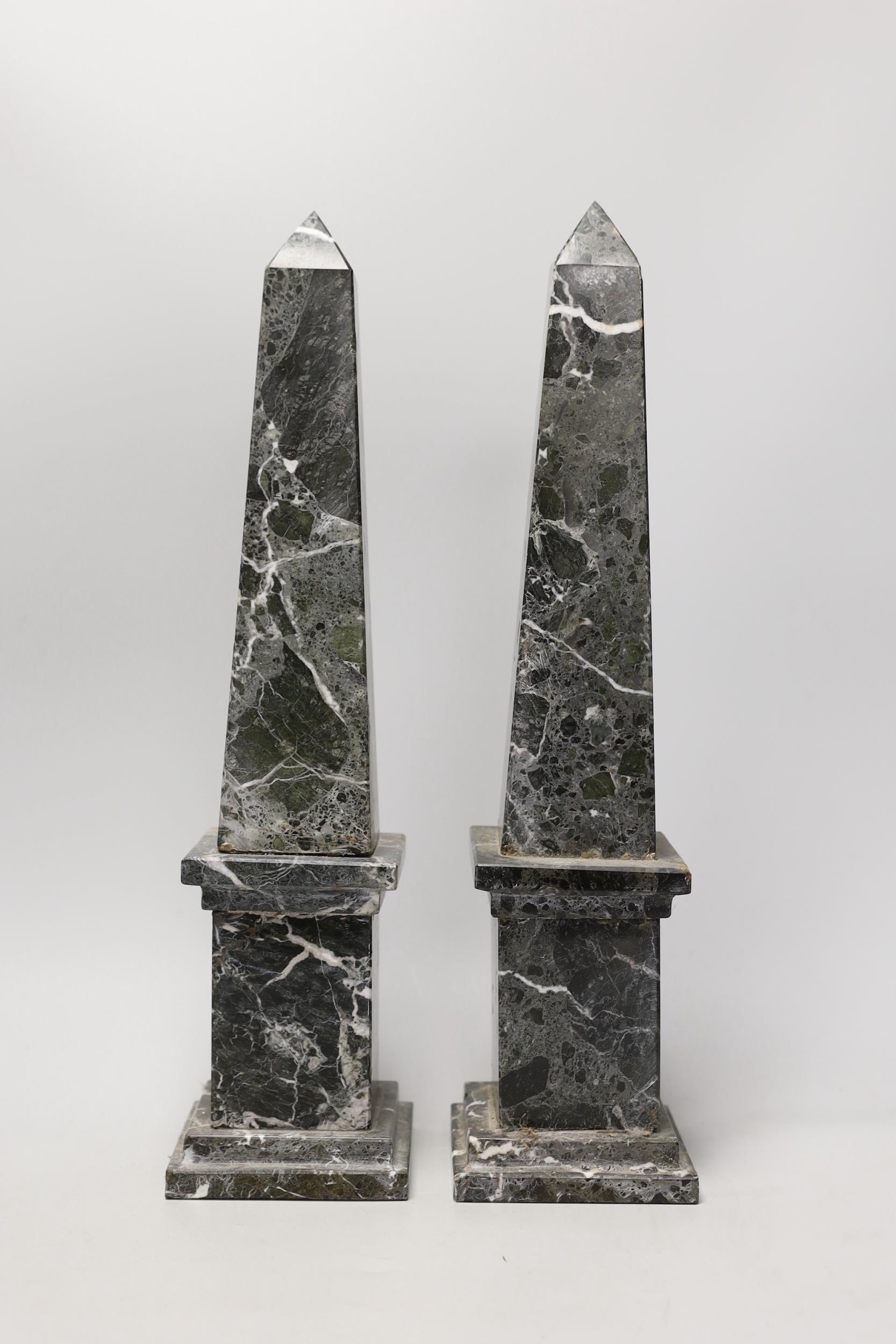 A pair of black and white variegated marble obelisks, 48cm - Image 2 of 2