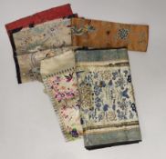 Three late 19th century Chinese silk embroidered panels, possibly made from sleeve bands, together
