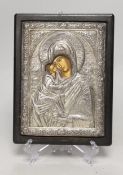 A white metal overlaid Greek or Russian icon, 24 x 18cm including frame